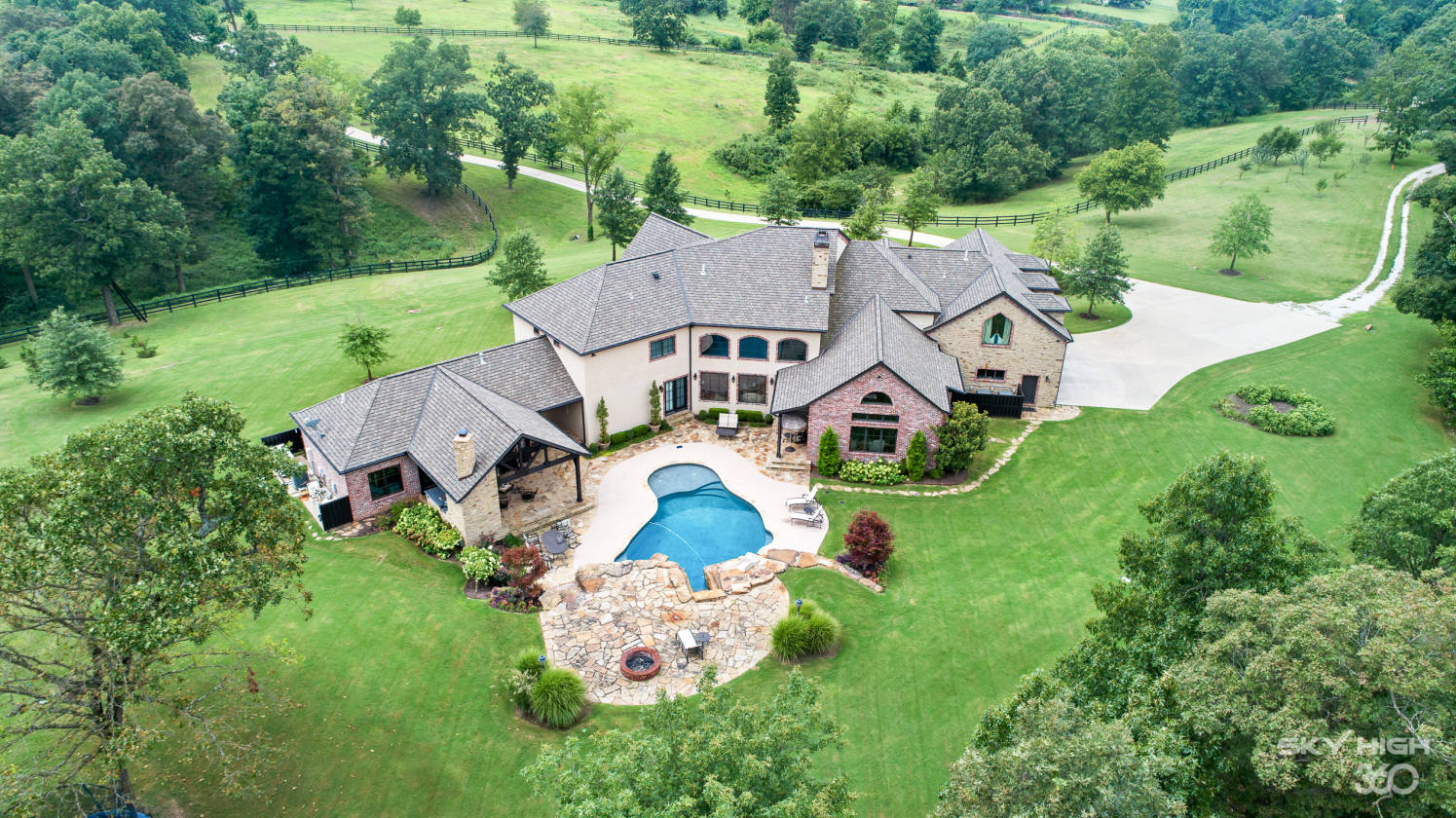 Luxury estate on 43+ acres with equestrian pastures, barn, and