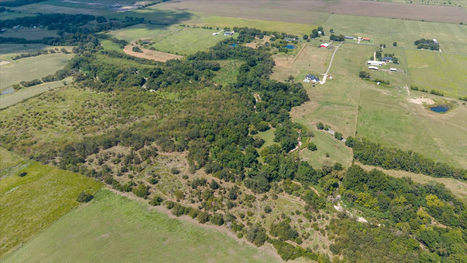 Gorgeous Farmhouse on 38+ Acres w/ Creek and Pond - photo 11
