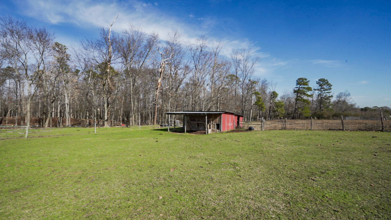 Elegantly designed farmhouse featuring 37.40 acres +/ with barn