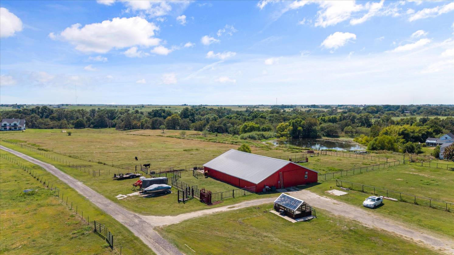 Gorgeous Farmhouse on 38+ Acres w/ Creek and Pond - photo 5