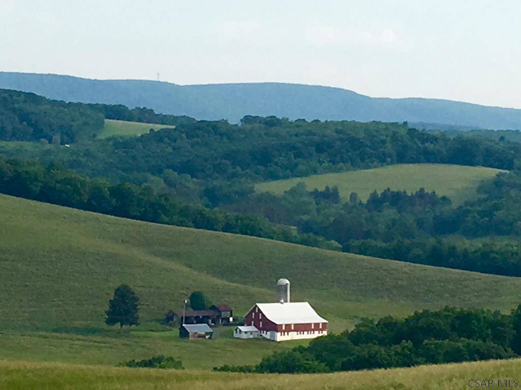 Fortyeight rolling acres of enchanting land with a breathtaking pond