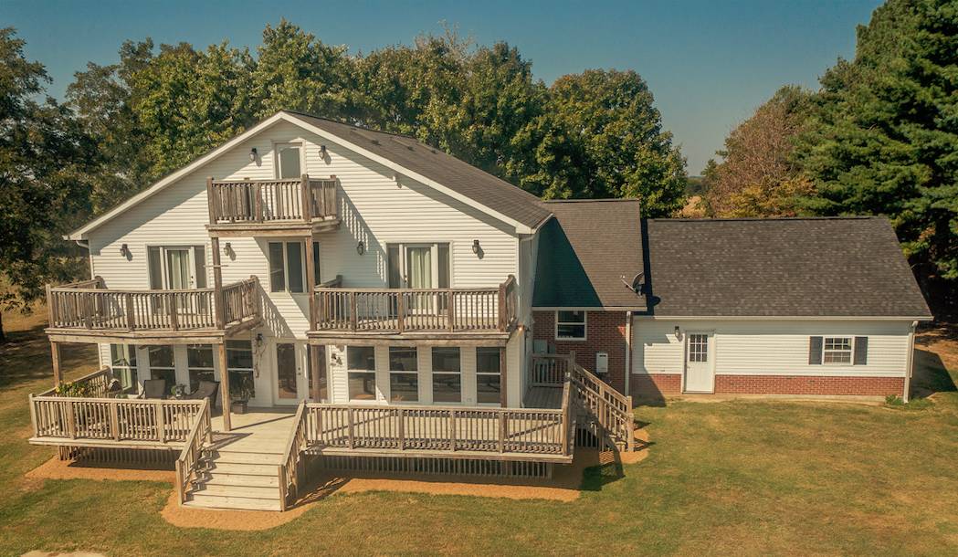 Elegantly designed farmhouse featuring 37.40 acres +/ with barn