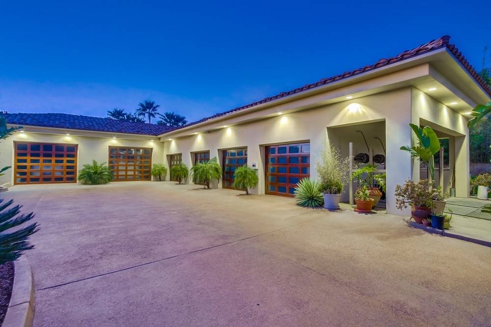 Stunning gated single story, 9 car garage, equestrian estate on 16.7