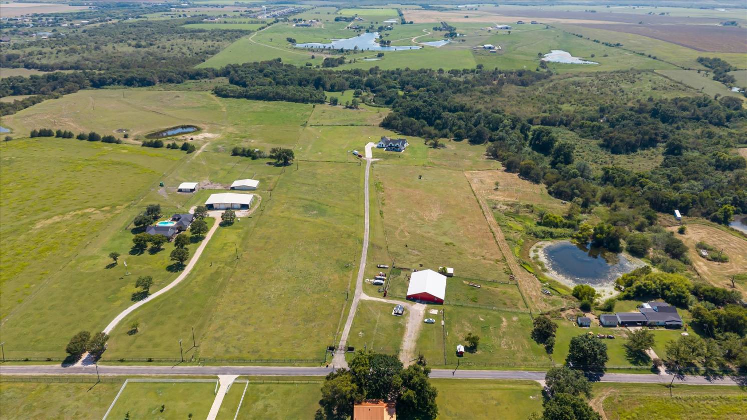 Gorgeous Farmhouse on 38+ Acres w/ Creek and Pond - photo 4