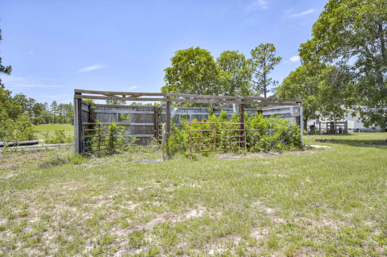 21.65 flat acres with large home and paddocks - photo 12
