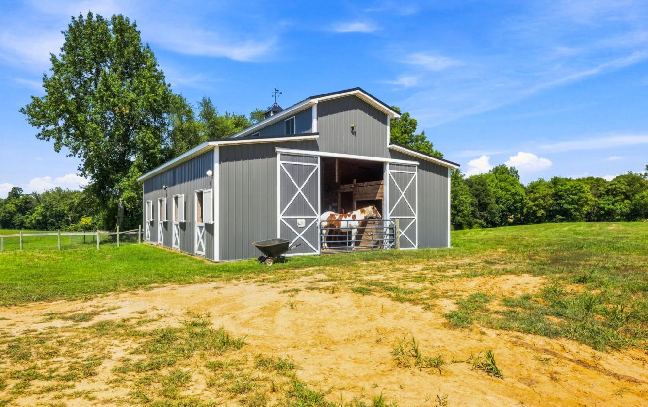 Multigenerational Home with 32 Acres & Horse Barn - photo 16