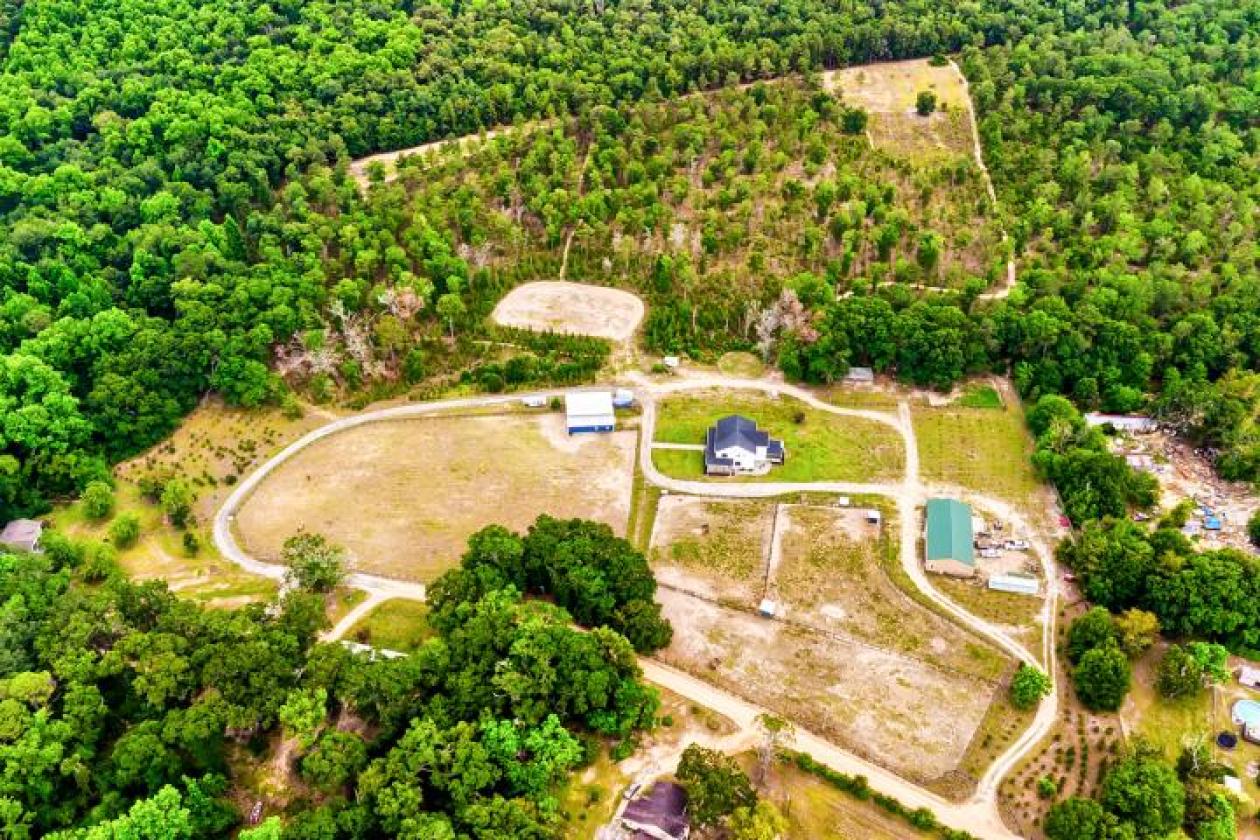 32.84 ACRES. EQUESTRIAN FACILITIES. - photo 1