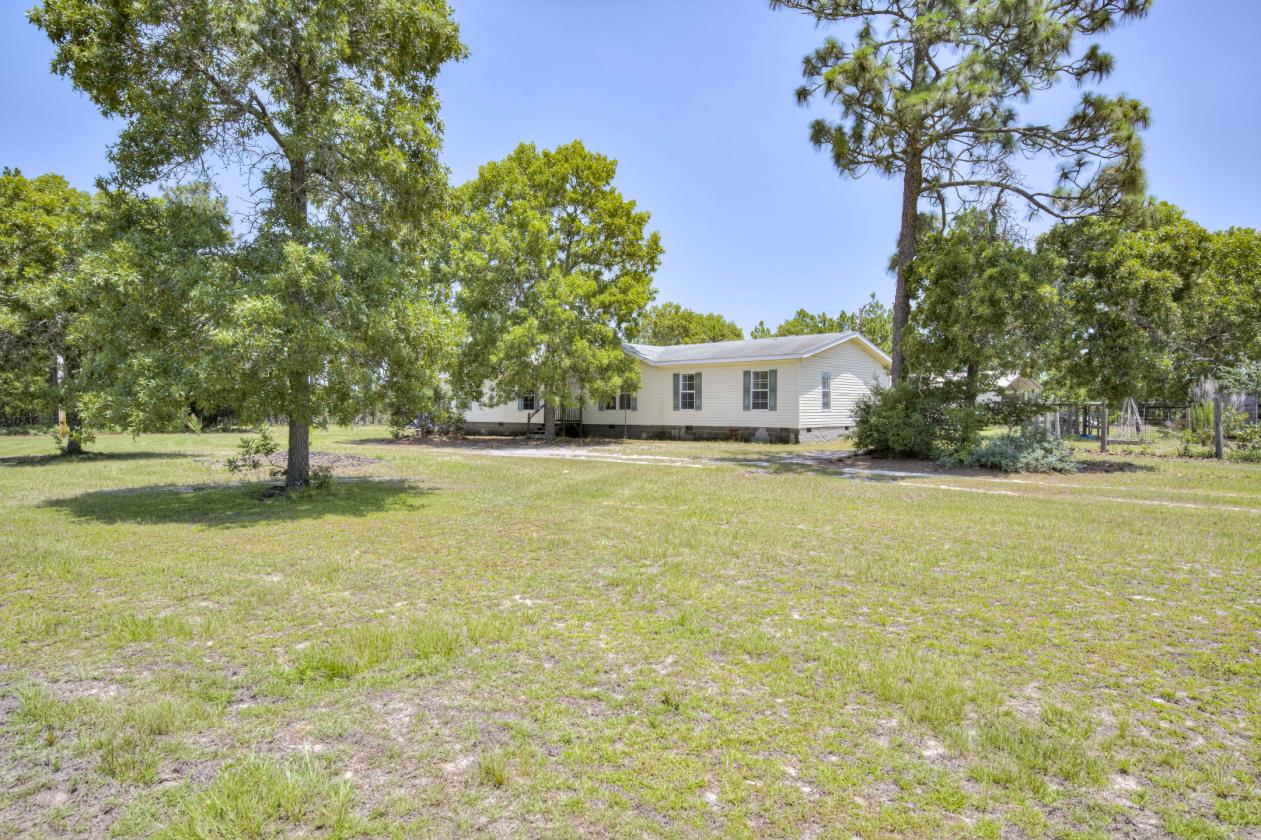 21.65 flat acres with large home and paddocks - photo 6
