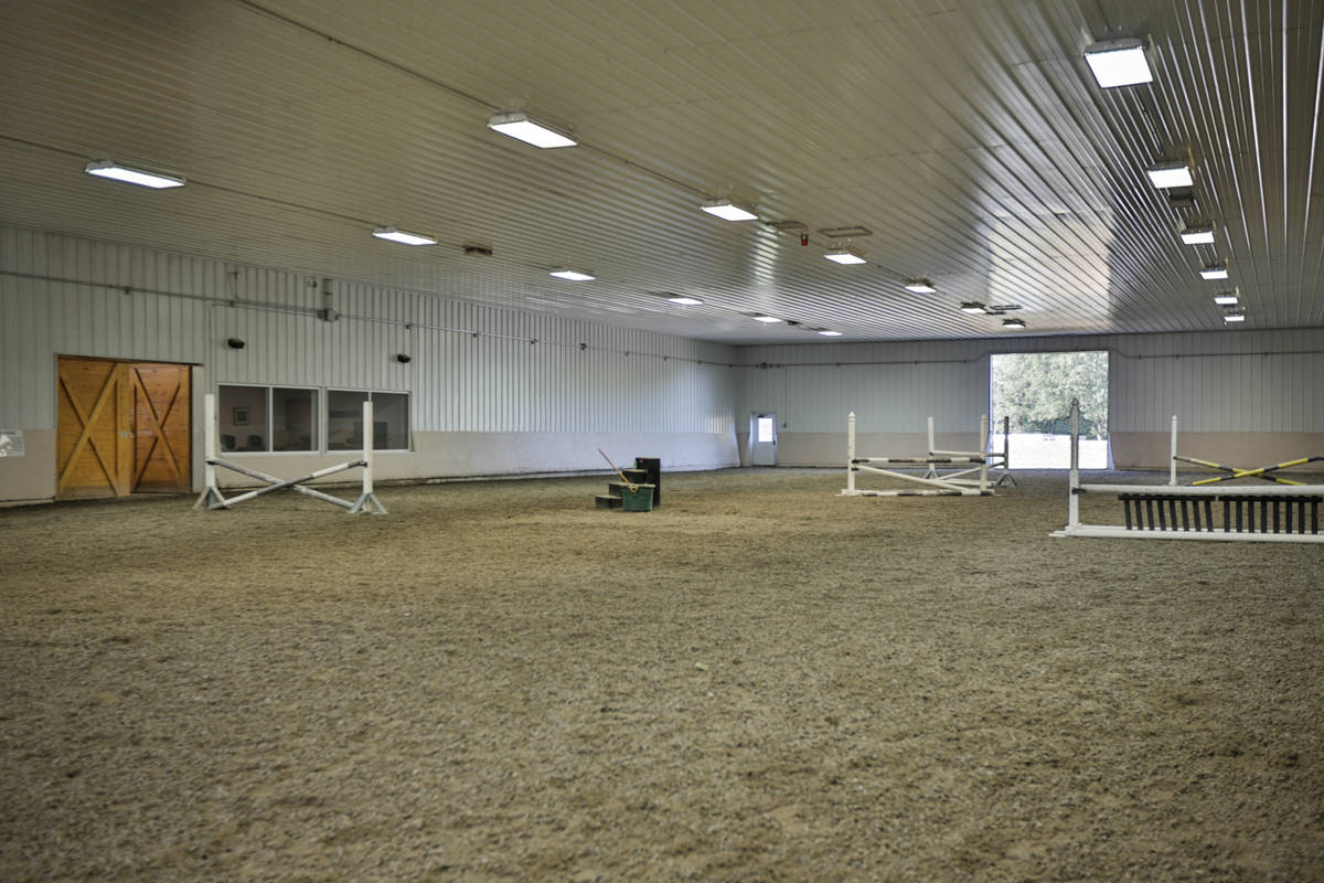 Luxury equestrian facility with remodeled home on a spectacular 21