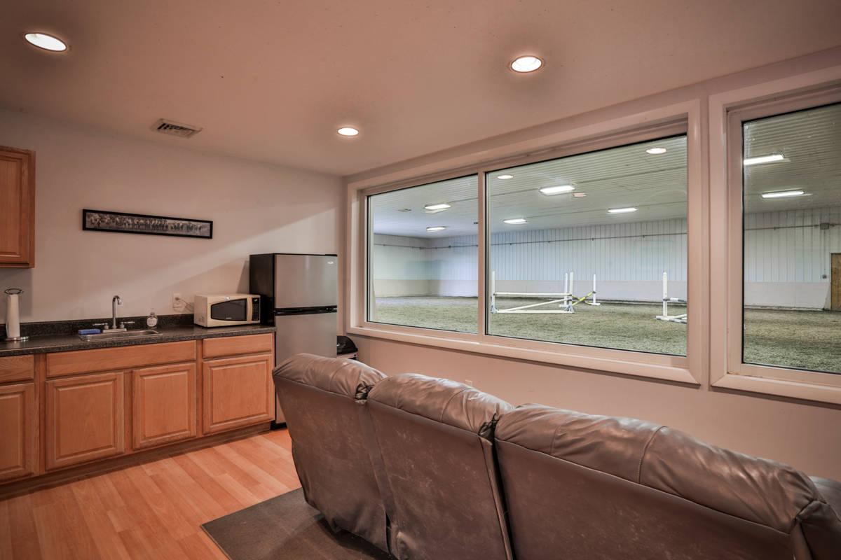 Luxury equestrian facility with remodeled home on a spectacular 21