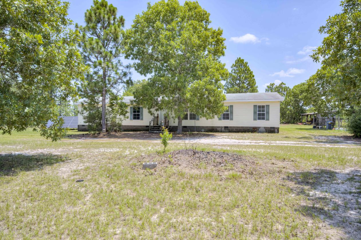 21.65 flat acres with large home and paddocks - photo 26