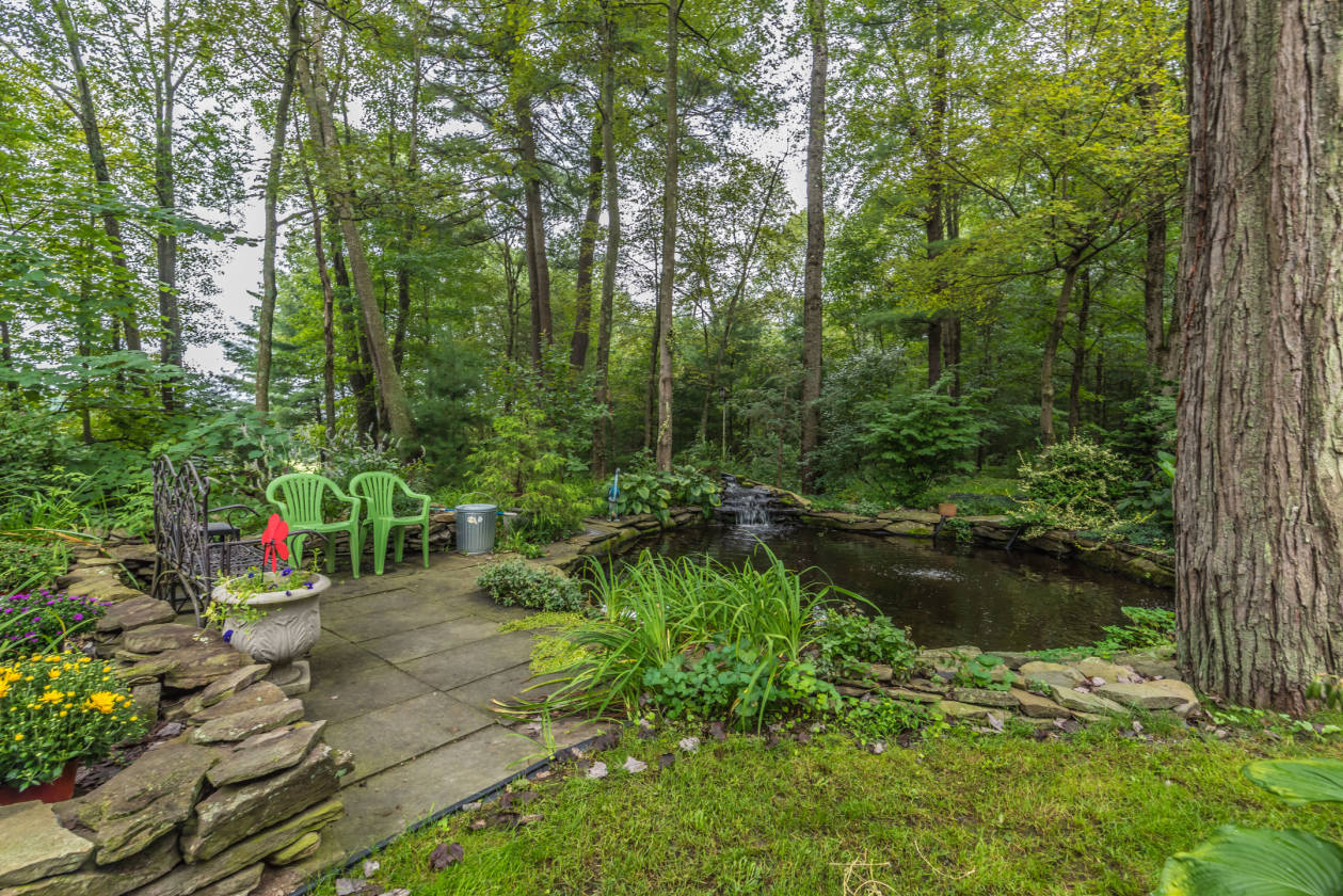 Custom built contemporary stone chalet with 52 acres of rolling