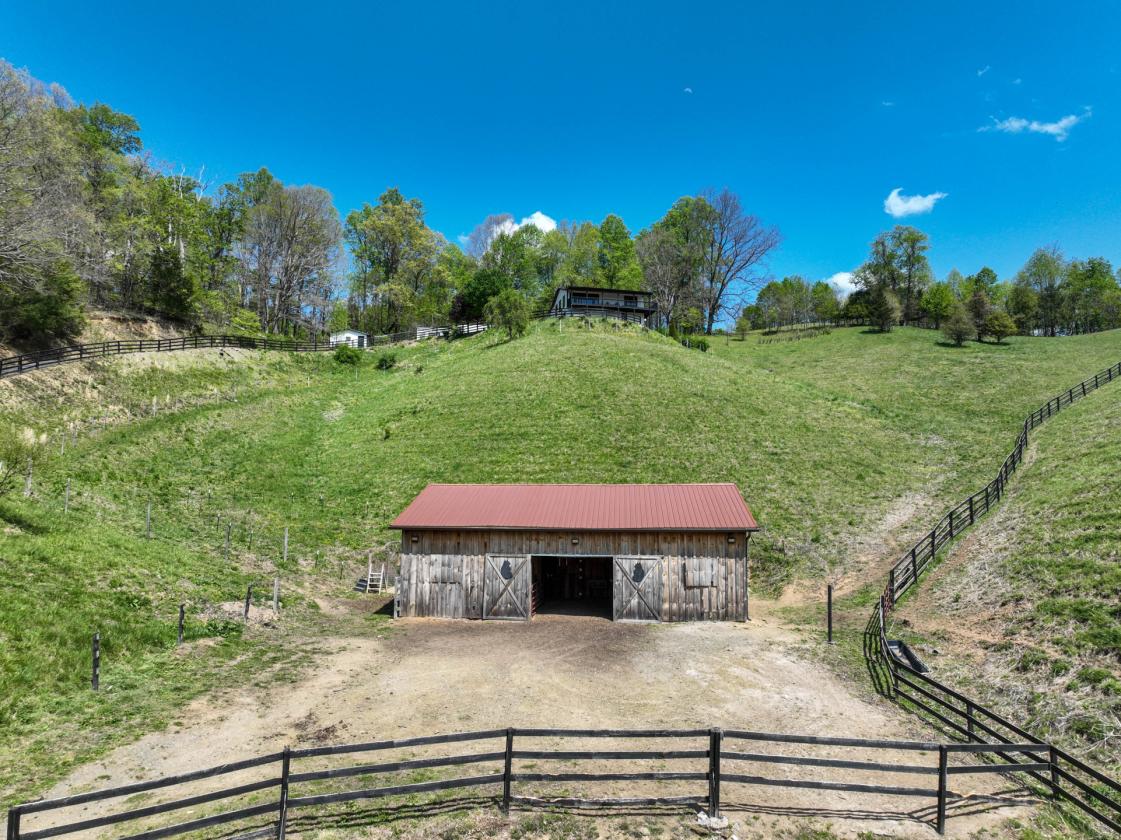 10 acres, multiple barns & homes, farm pond - photo 30