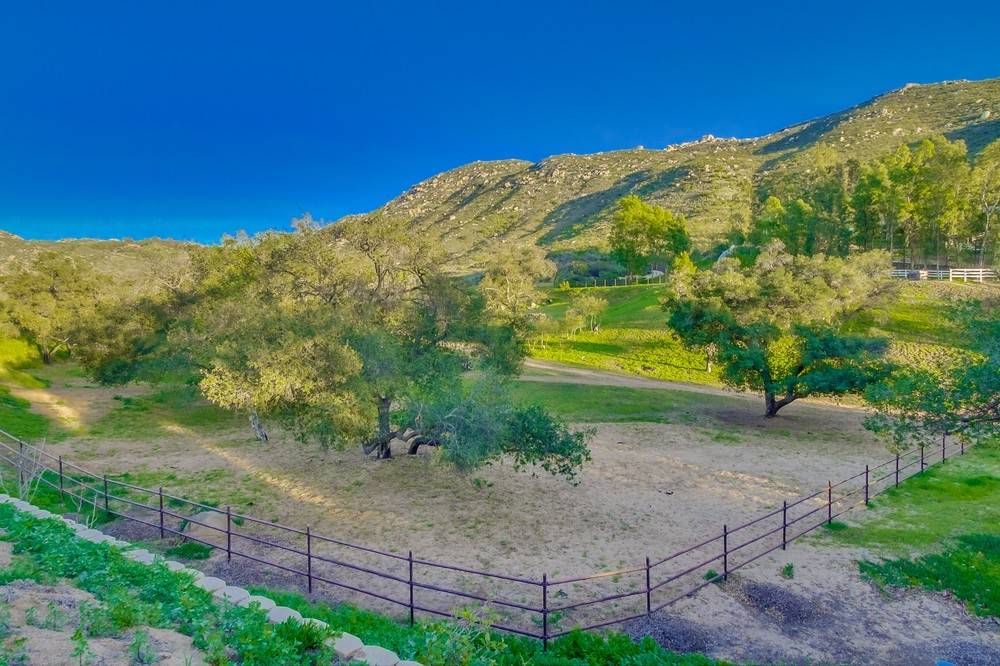 Stunning gated single story, 9 car garage, equestrian estate on 16.7