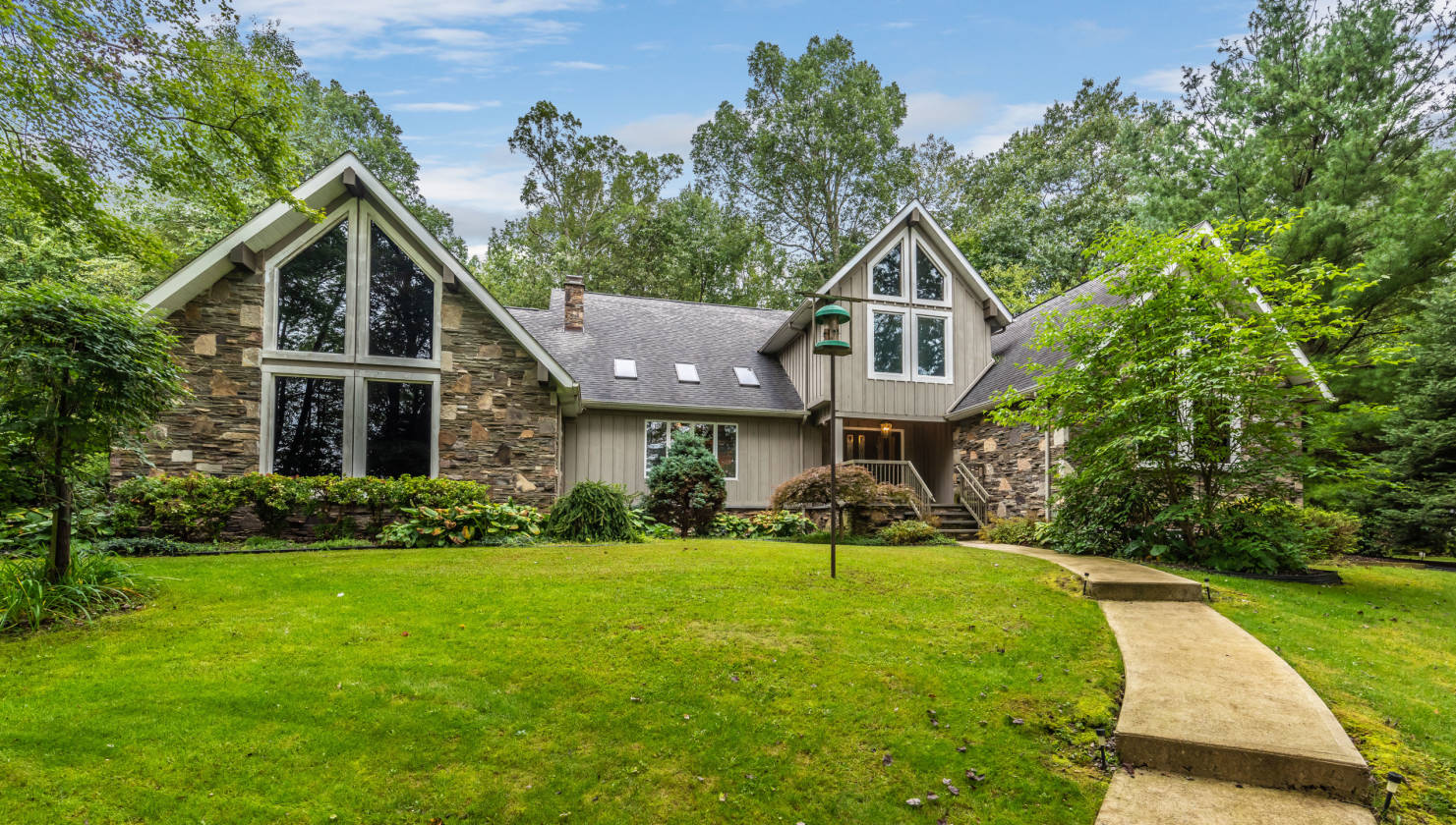 Custom built contemporary stone chalet with 52 acres of rolling