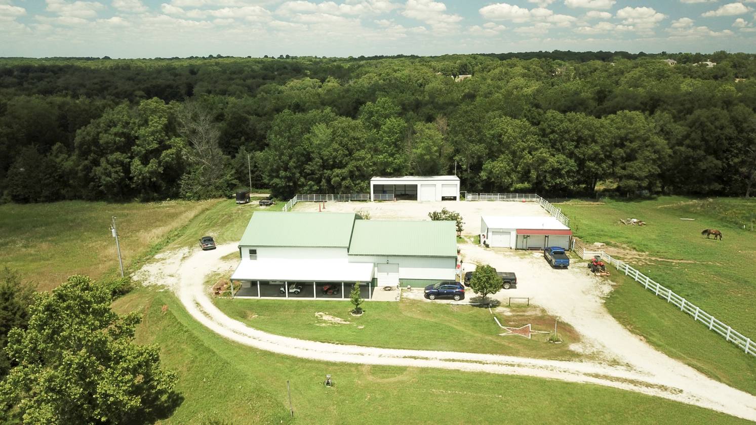 Barndominium in progress! 8+/ acre buildable lot w/horse barn, arena