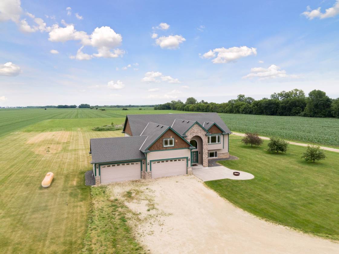 5 acre property with custom built home & pole barn. Northfield