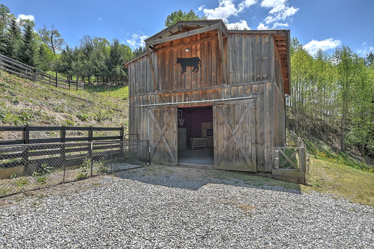 10 acres, multiple barns & homes, farm pond - photo 23