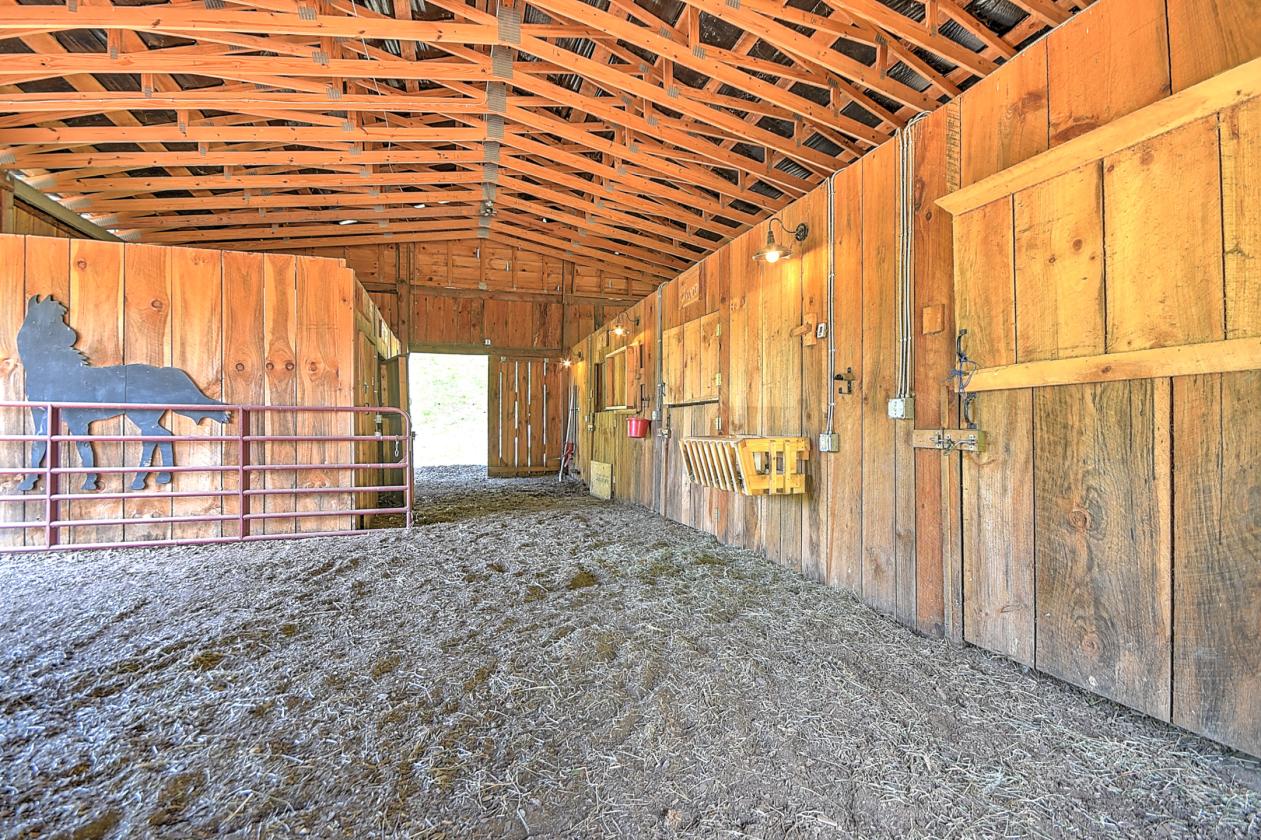 10 acres, multiple barns & homes, farm pond - photo 19