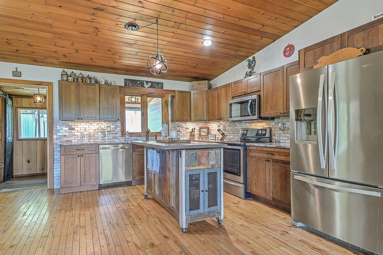 10 acres, multiple barns & homes, farm pond - photo 3