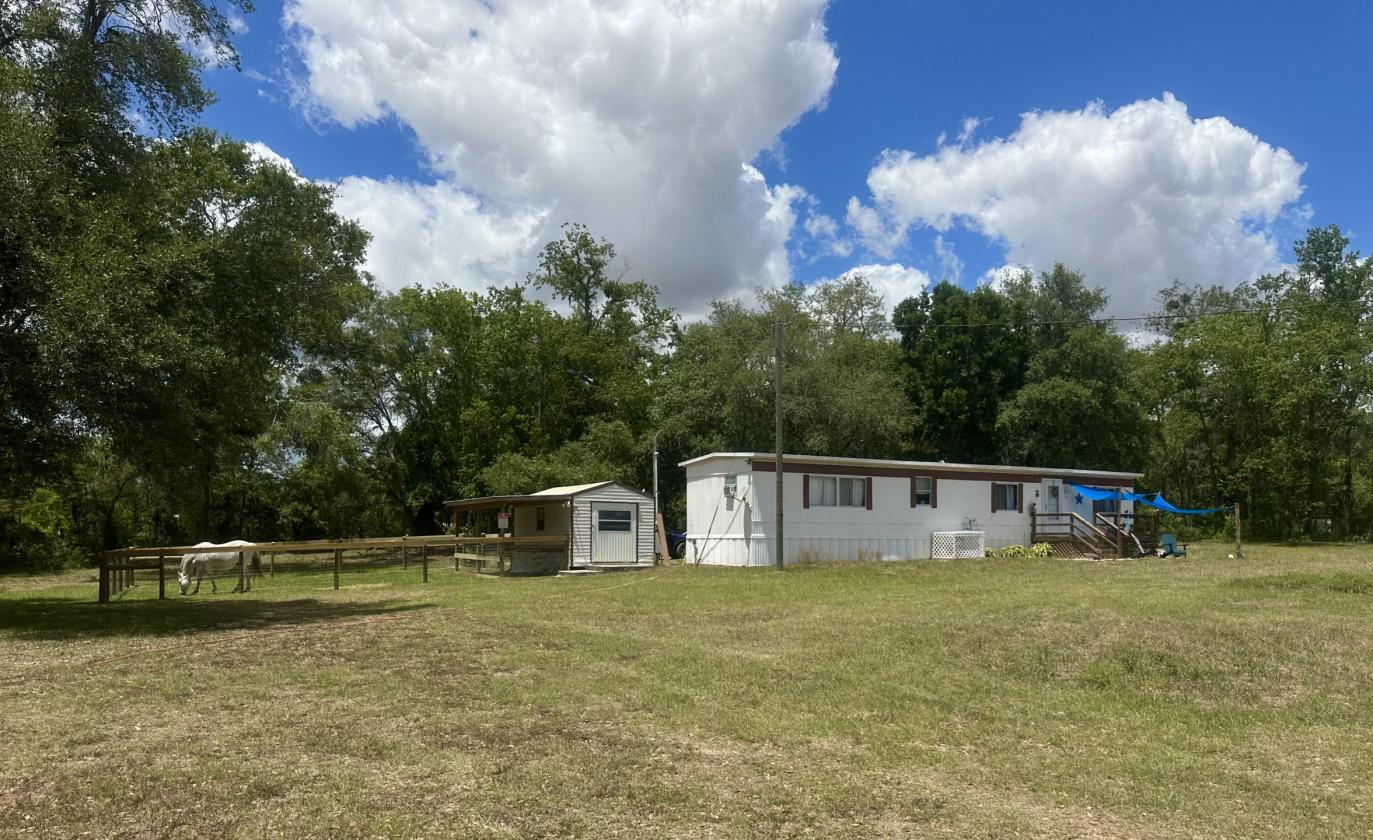 2.5 Acres of Mini Farm Living + Income Potential! - photo 1