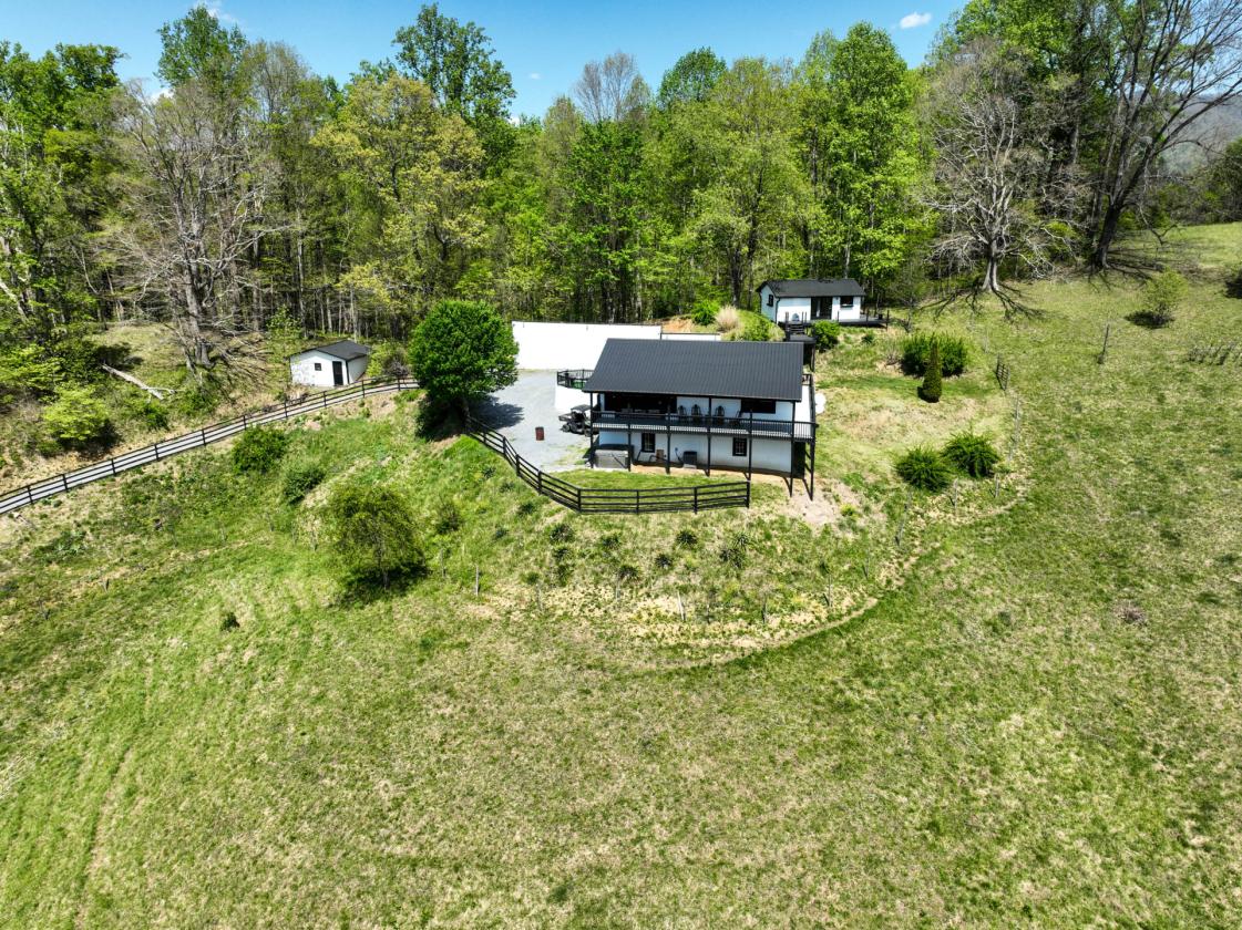 10 acres, multiple barns & homes, farm pond - photo 29