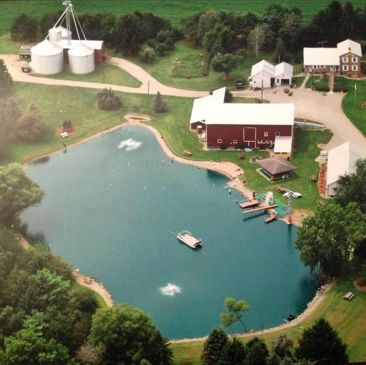 A business opportunity! 1.5 acre pond, several barns and house