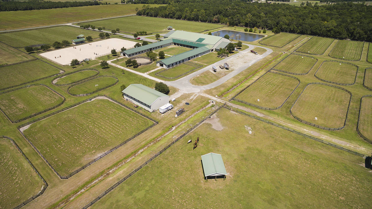 Premier Equestrian Facility with indoor arena, living quarters, barns