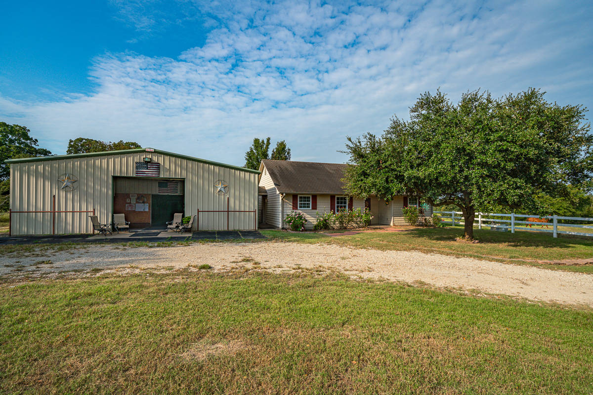STUNNING EXECUTIVE HOME ON ALMOST 19ACRES OF IMPROVED PASTURE, WOODS