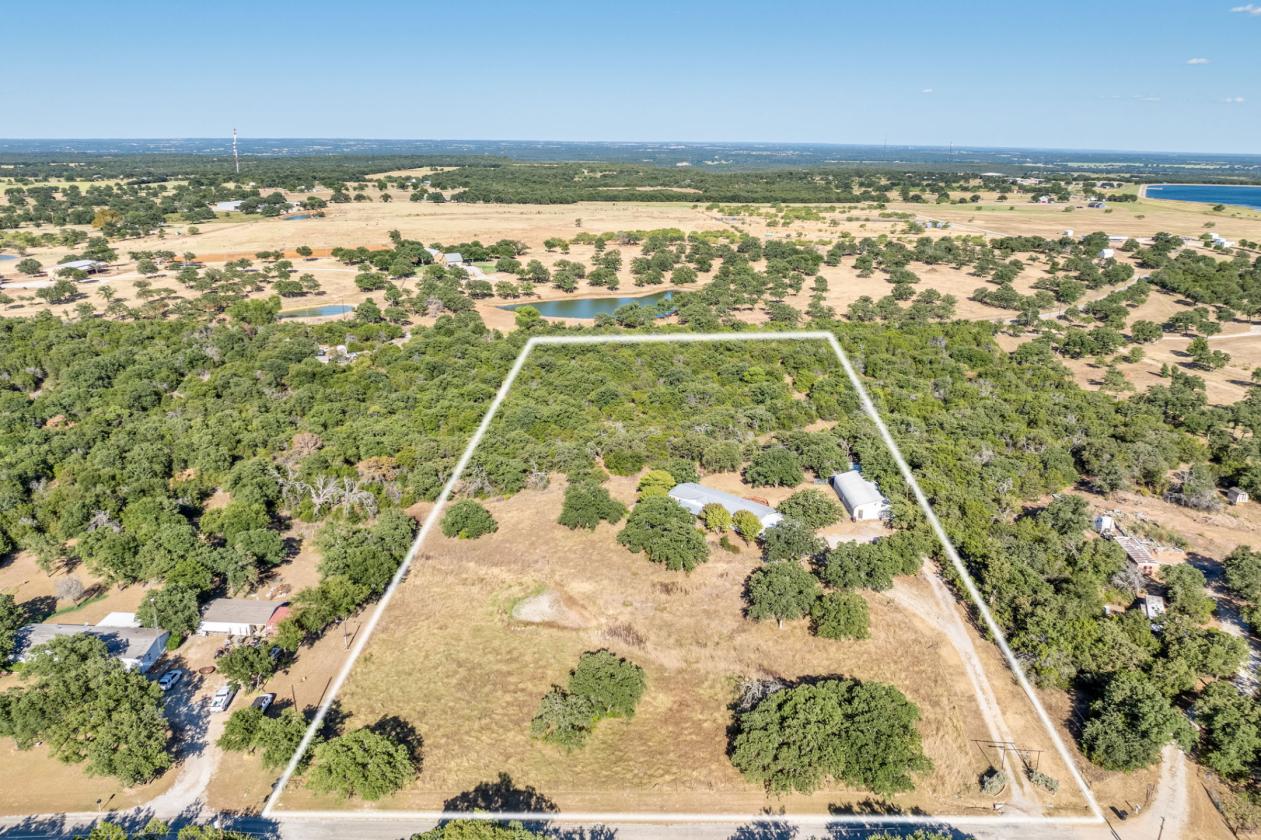 AG EXEMPT, NEARLY 7 ACRES, PLENTY OF GRASS! - photo 2
