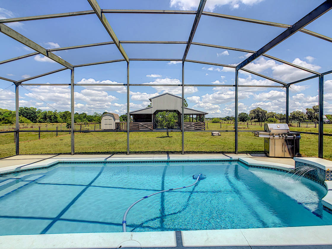 CUSTOM BUILT POOL HOME WITH TWO PADDOCKS, STABLES ON 6.63... Winter