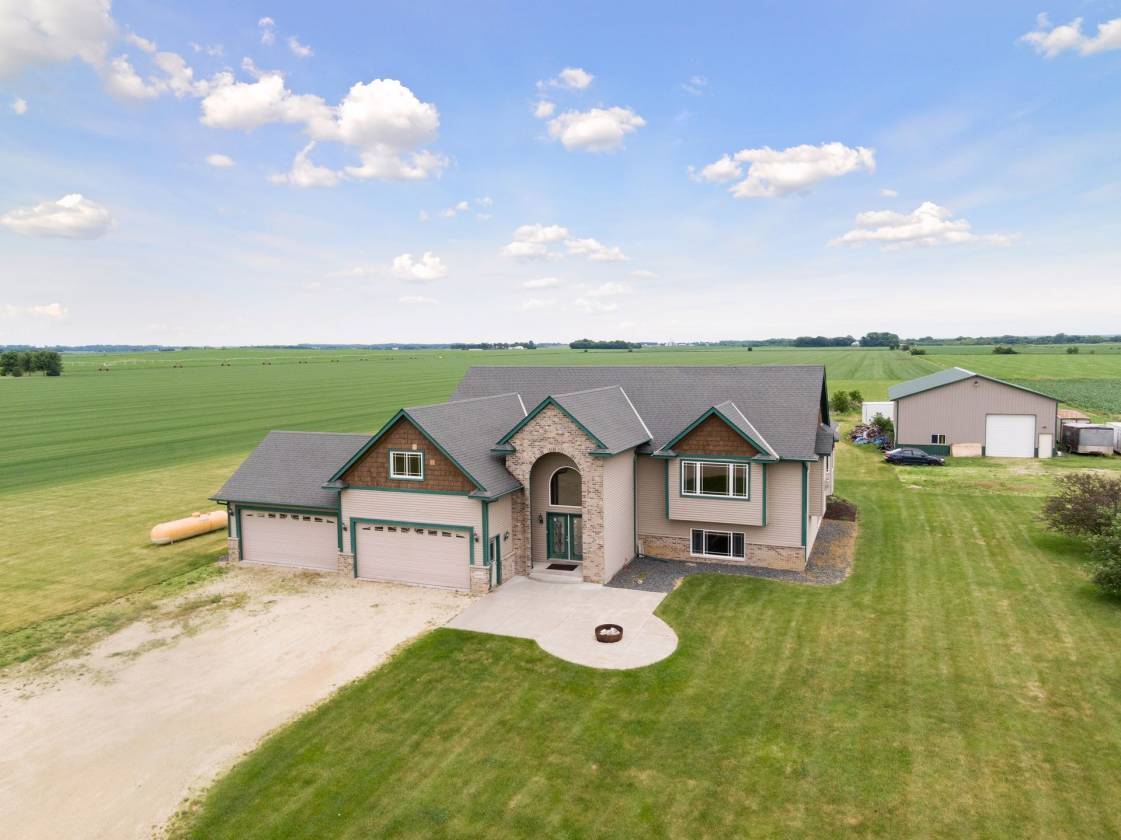 5 acre property with custom built home & pole barn. Northfield