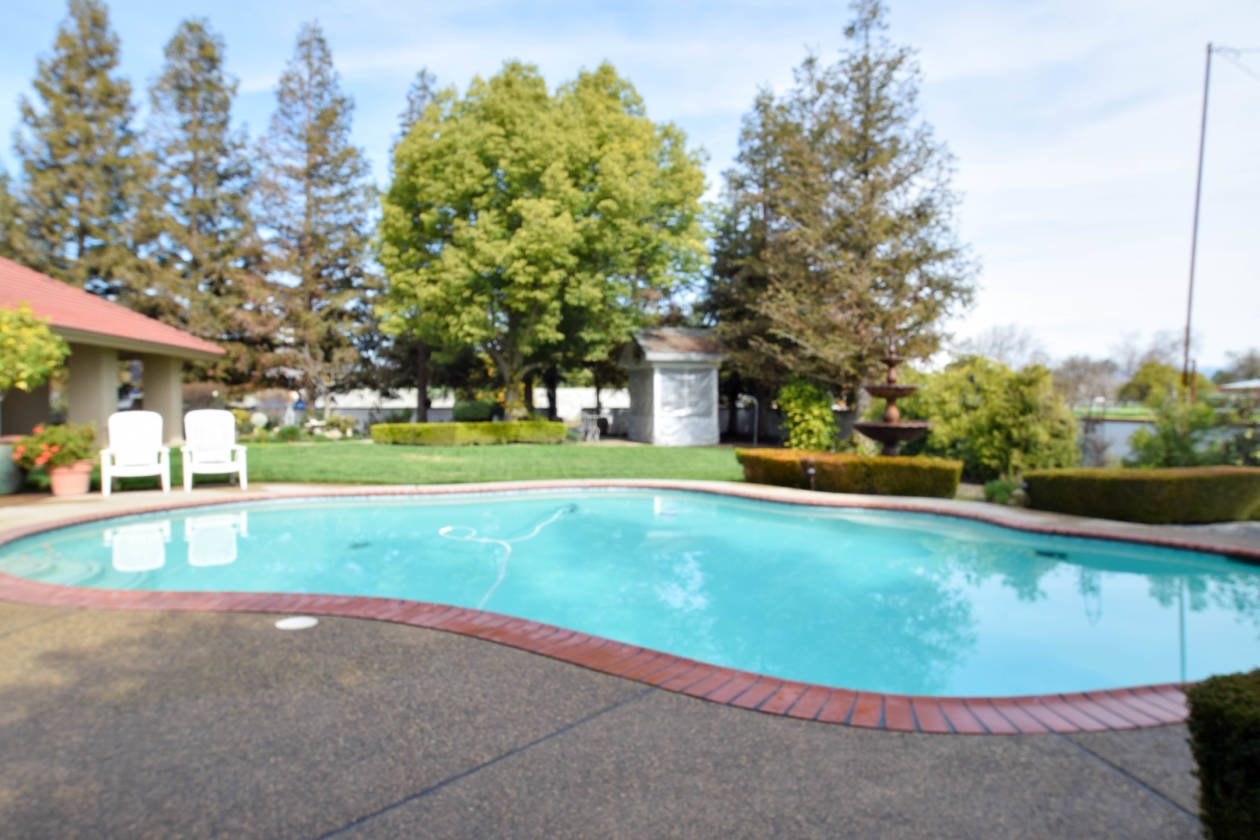 Beautiful Custom Home with Roping Arena, Storage/Tack Room and 4