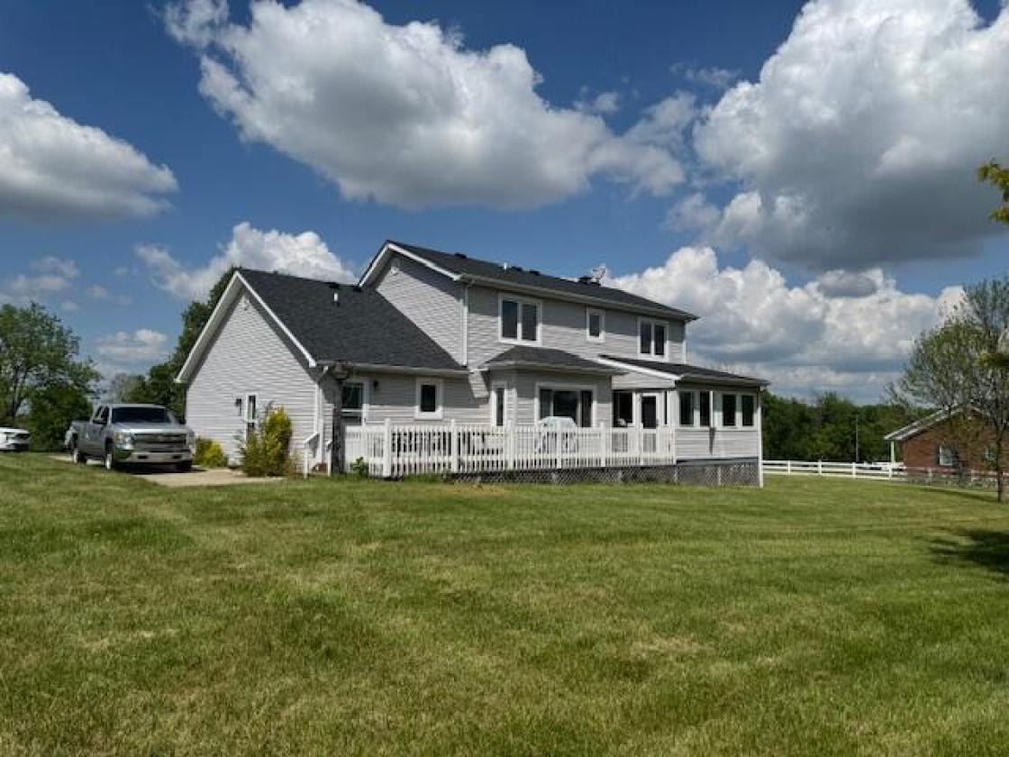 Beautiful home with Barn & Pond and fenced acreage - photo 1
