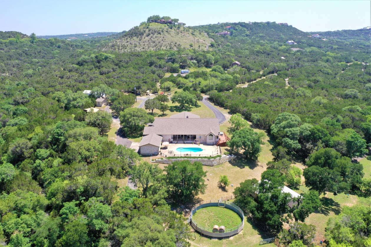 STUNNING equestrian estate on 14.2 acres with city convenience! San