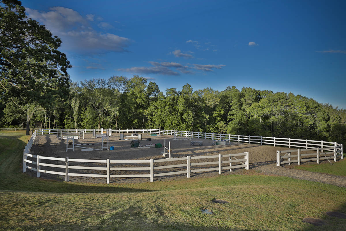 Luxury equestrian facility with remodeled home on a spectacular 21
