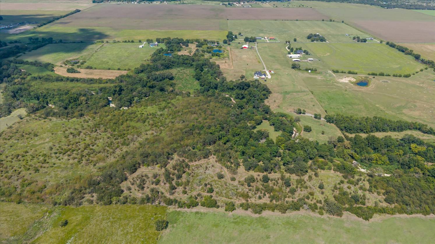 Gorgeous Farmhouse on 38+ Acres w/ Creek and Pond - photo 10
